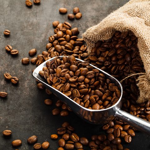 Cup,Of,Coffee,,Bag,And,Scoop,On,Old,Rusty,Background